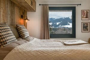 Megeve chalet apartment bedroom Au Maison pillows Zara pillows Ellos bedspread