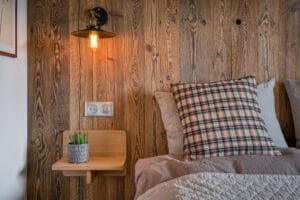 Megeve chalet apartment bedroom Au Maison pillows Zara pillows Ellos bedspread