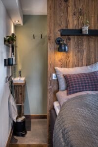 Megeve chalet apartment bedroom Au Maison pillows Trademark living shelf Ellos bedspread