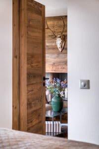 Megeve chalet apartment bedroom recycled wood door