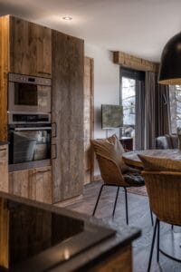 Megeve Chalet apartment Trademark Living dining table House Doctor chair Normann Copenhagen lamp
