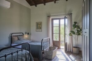 bedroom bed pillows Au Maison view of vineyard Piemonte