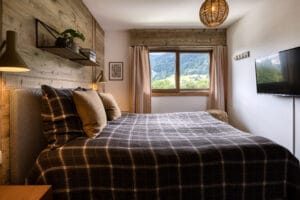 Megeve chalet bedroom bed shelf view nature