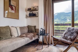 Megeve chalet living room sofa pillows chair view nature
