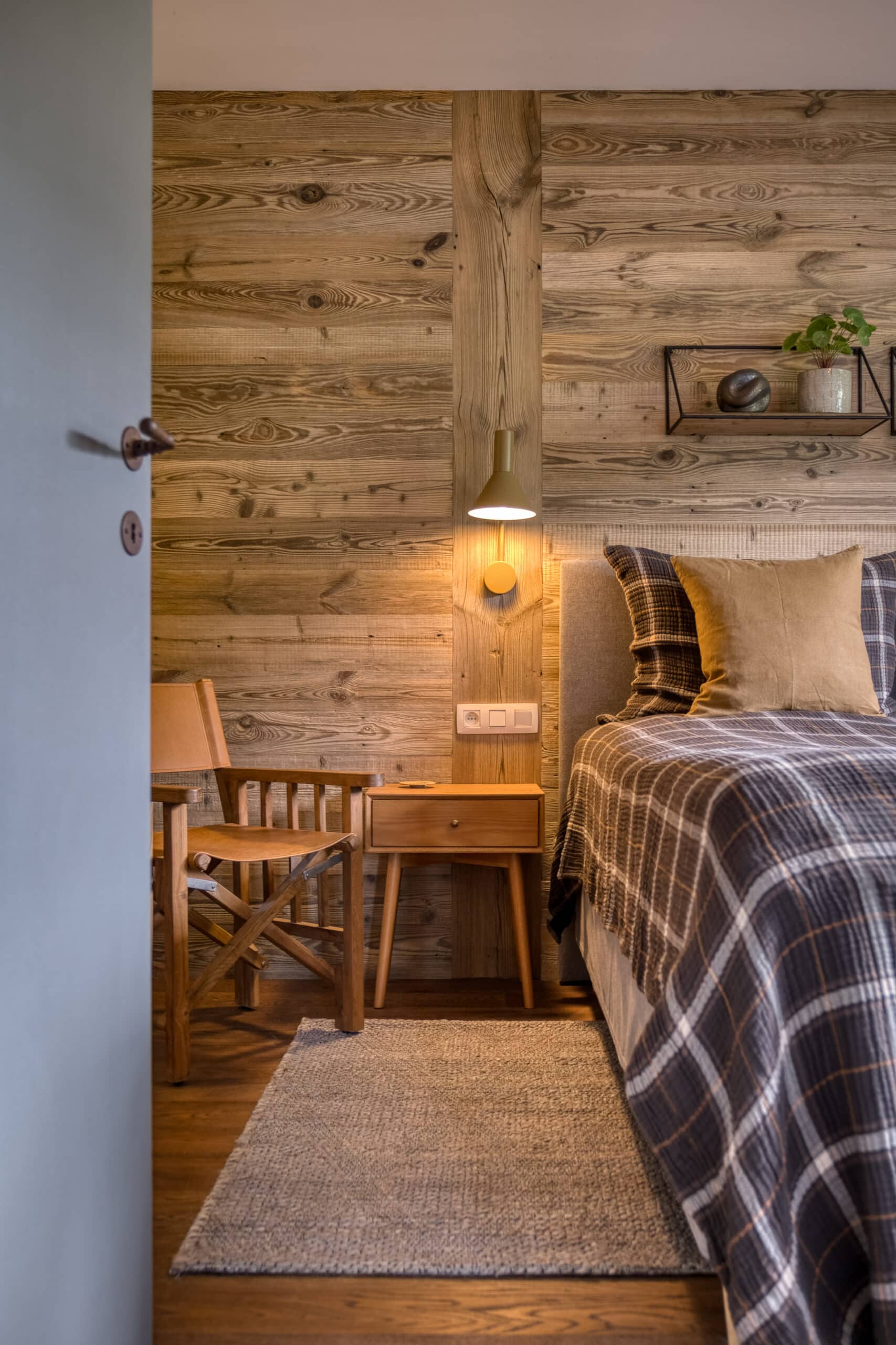 Megeve chalet bedroom bed chair shelf lamp