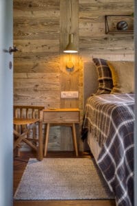 Megeve chalet bedroom bed chair shelf
