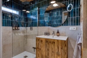 Megeve chalet bathroom recycled wood mirror blue tiles