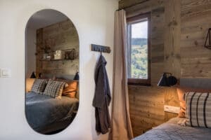 Megeve chalet bedroom bed pillows mirror