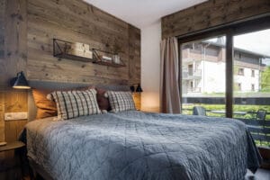 Megeve chalet bedroom bed pillows shelfs