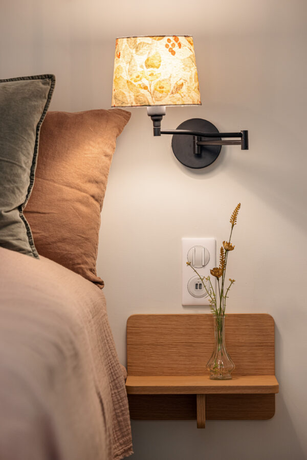 bedroom bed pillows nightstand lamp flowers